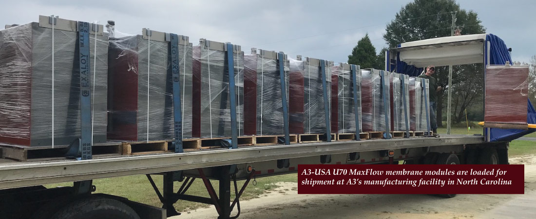 Image of A3 MaxFlow flat plate membrane modules being lifted onto a truck for shipment