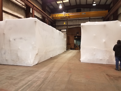 Image of packaged MBR wastewater treatment plants wrapped and ready to ship