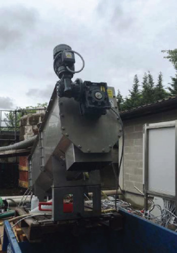 image of an A3 sludge screw press installed at a winery